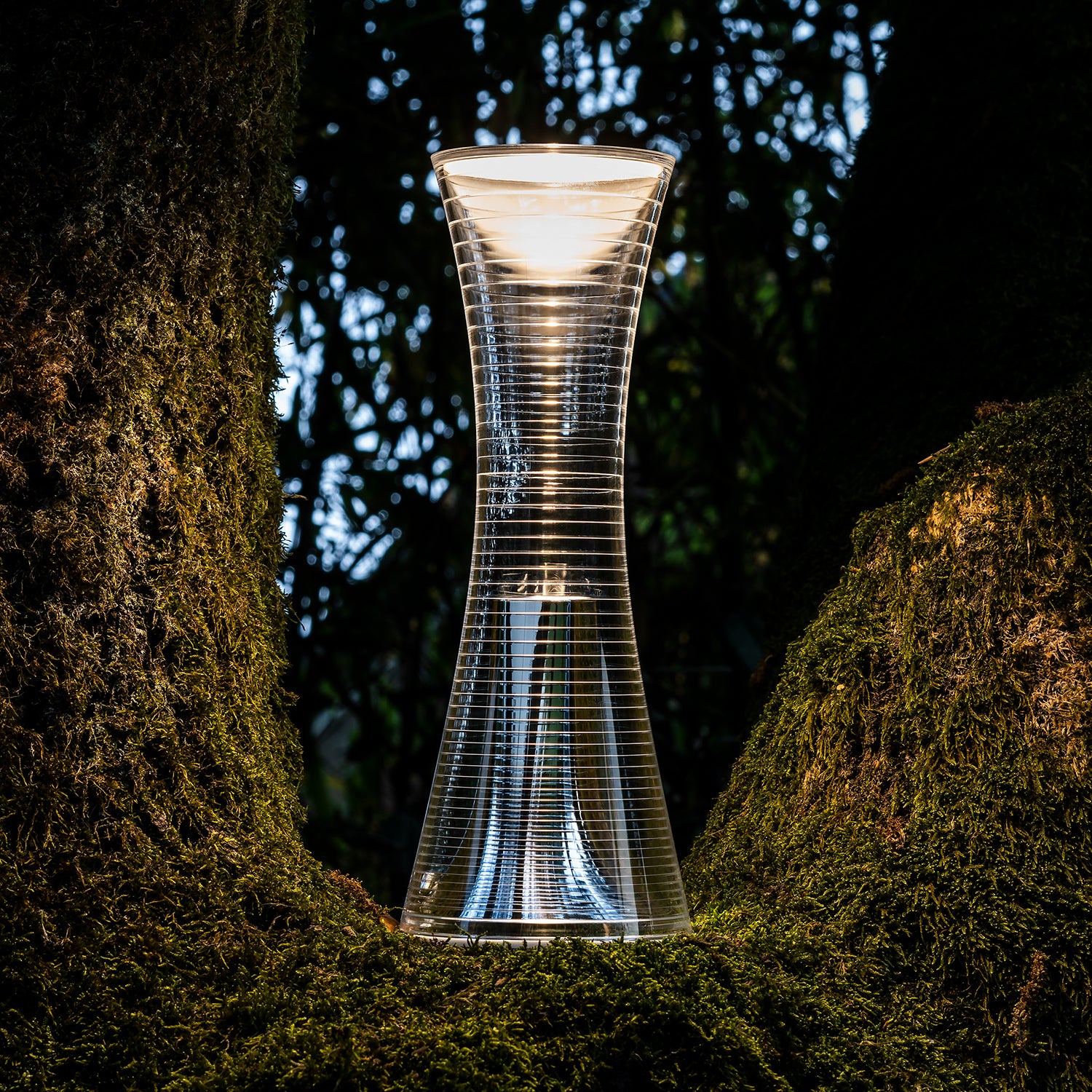 Artemide Come Together Portable Lamp Ambience image showing lamp on moss