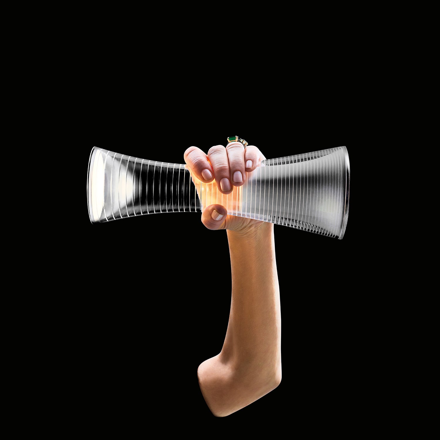 Artemide Come Together Portable Lamp Ambience image showing a hand holding the lamp