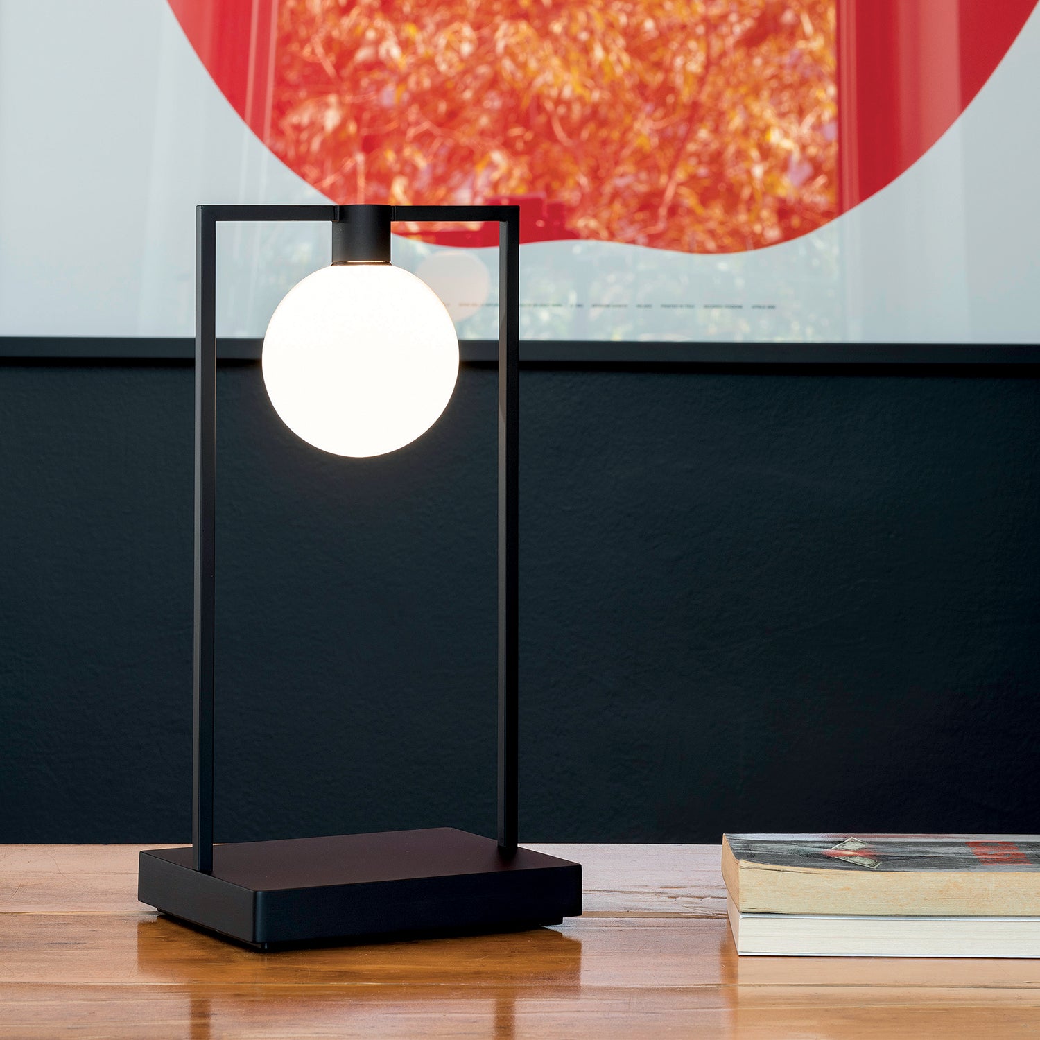Artemide Curiosity 36 Sphere Portable Table Lamp on a table