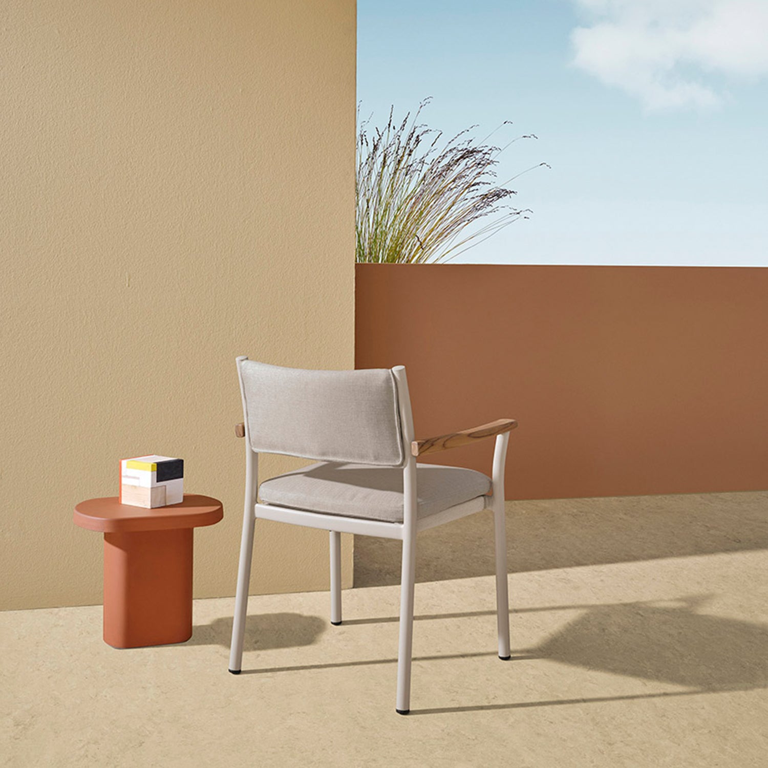 Pedrali 3694+3694.5 outdoor dining chair in beige frame and grey upholstery ambience image