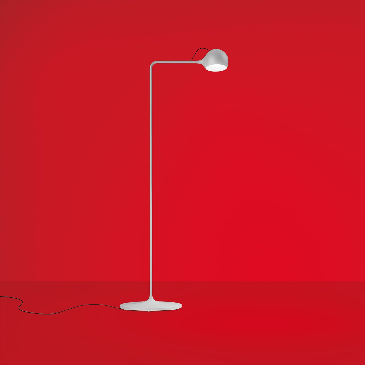 Artemide IXA reading in grey with red background