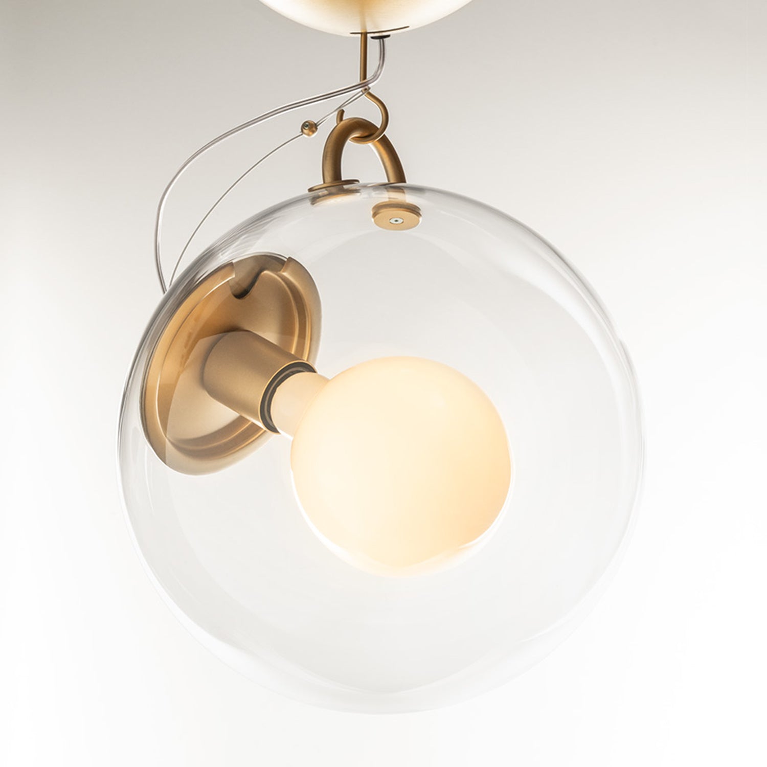 Artemide Miconos ceiling light in brass ambience image