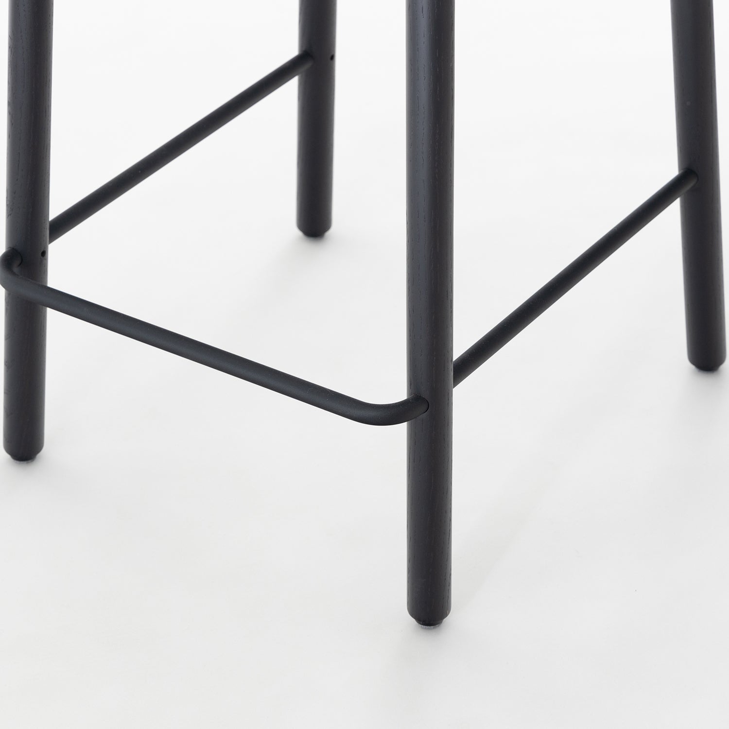 John Green Stool in black Oak leg detail image