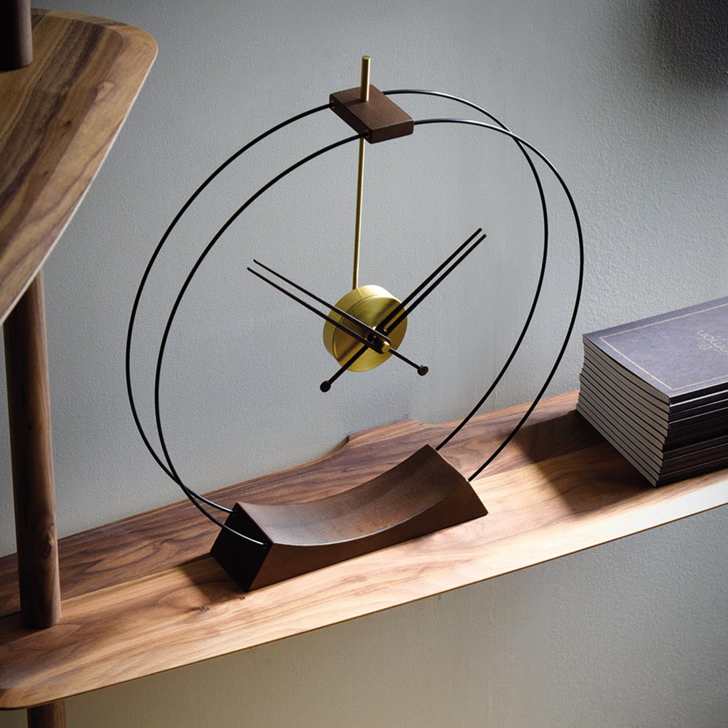 Nomon Aire Table Clock in walnut and brass ambience image