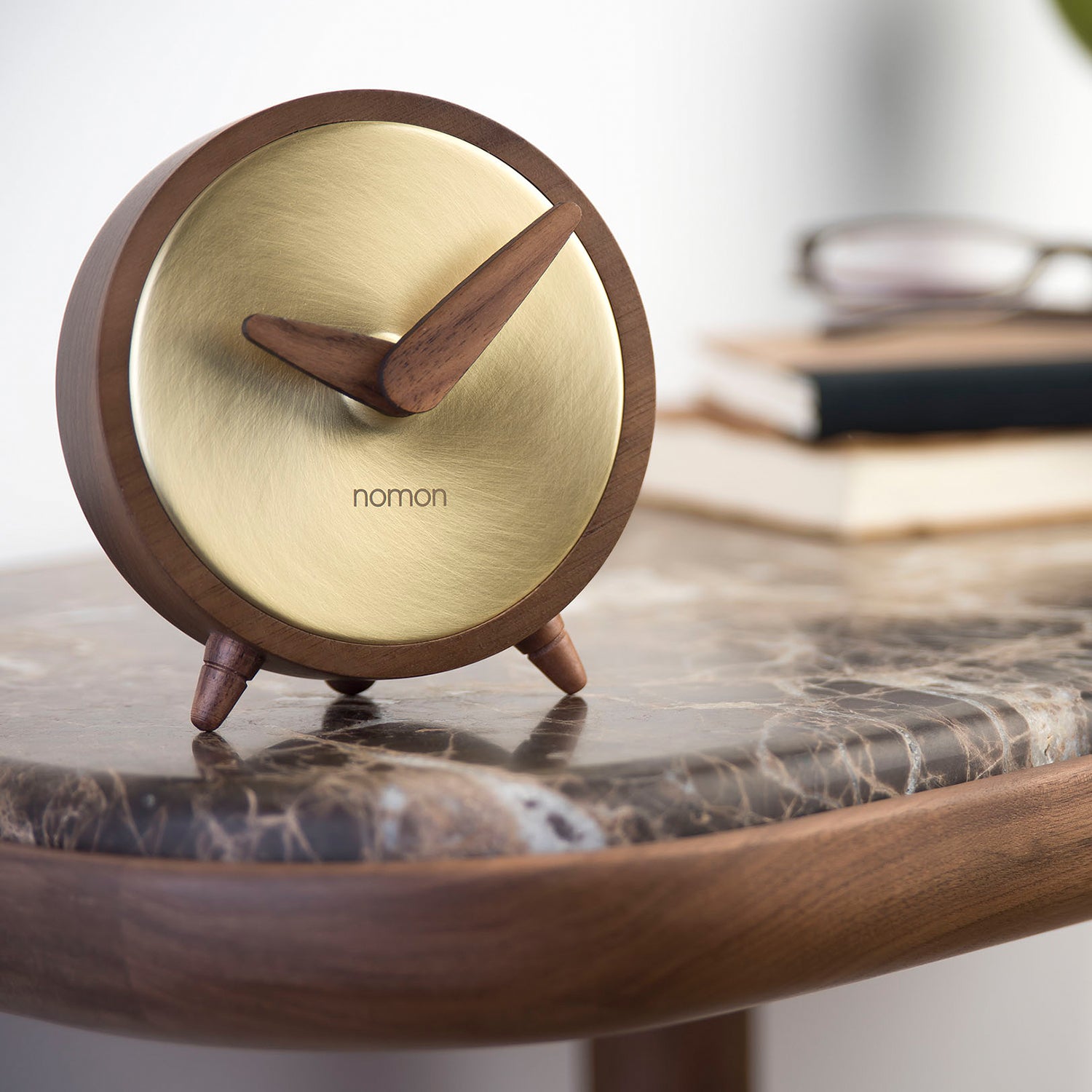 Nomon Atomo table clock in walnut and brass ambience image