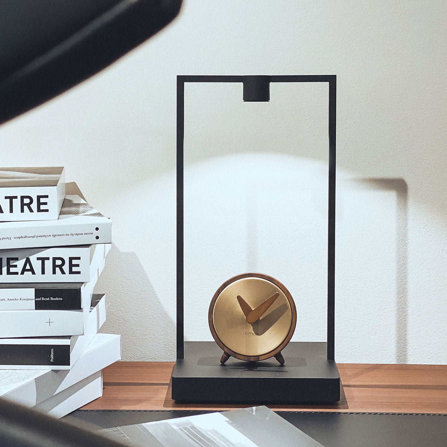 Nomon Atomo table clock in walnut and brass ambience image