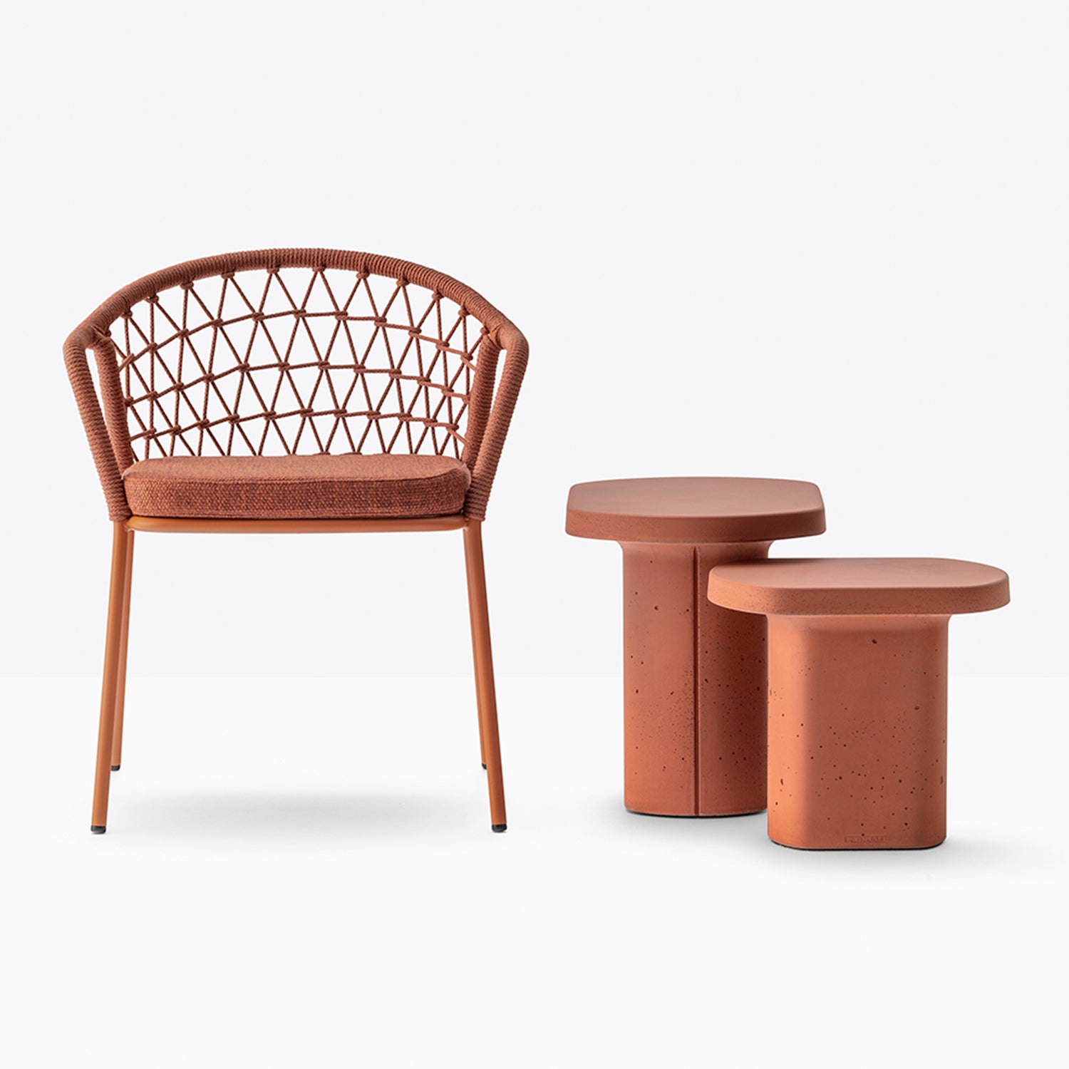 Pedrali Panarea 3675 Outdoor Dining Chair in terracotta with caementum side tables