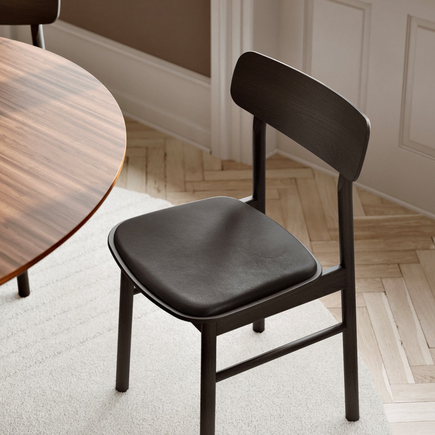 Woud Soma Dining Chair in black with black leather